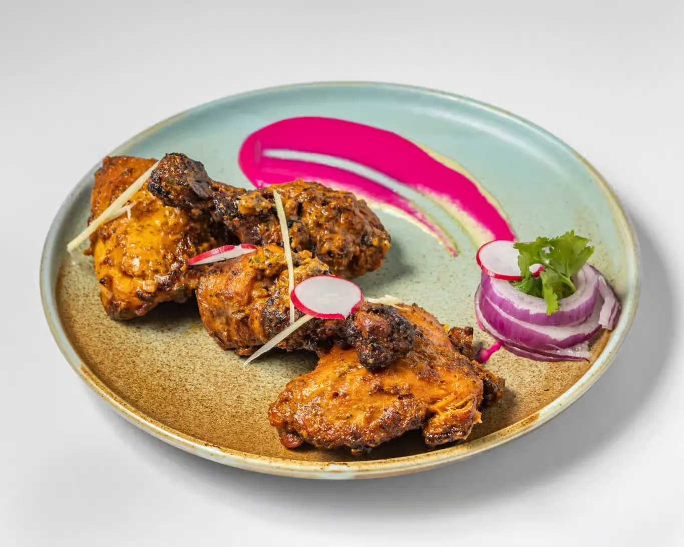 Tandoori Chicken roasted in clay oven at Karma Fine Indian Cuisine Southeast Calgary